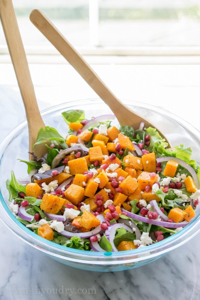 This super easy Butternut Squash Fall Salad is filled with pomegranate, feta cheese, purple onion and roasted butternut squash! It's such a great salad recipe to have on hand! 