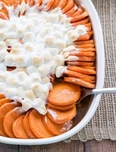 This No Boil Candied Sweet Potato Casserole is a crazy simple side dish recipe that's perfect for Thanksgiving or Christmas! I love this easy method of cooking the sweet potatoes!