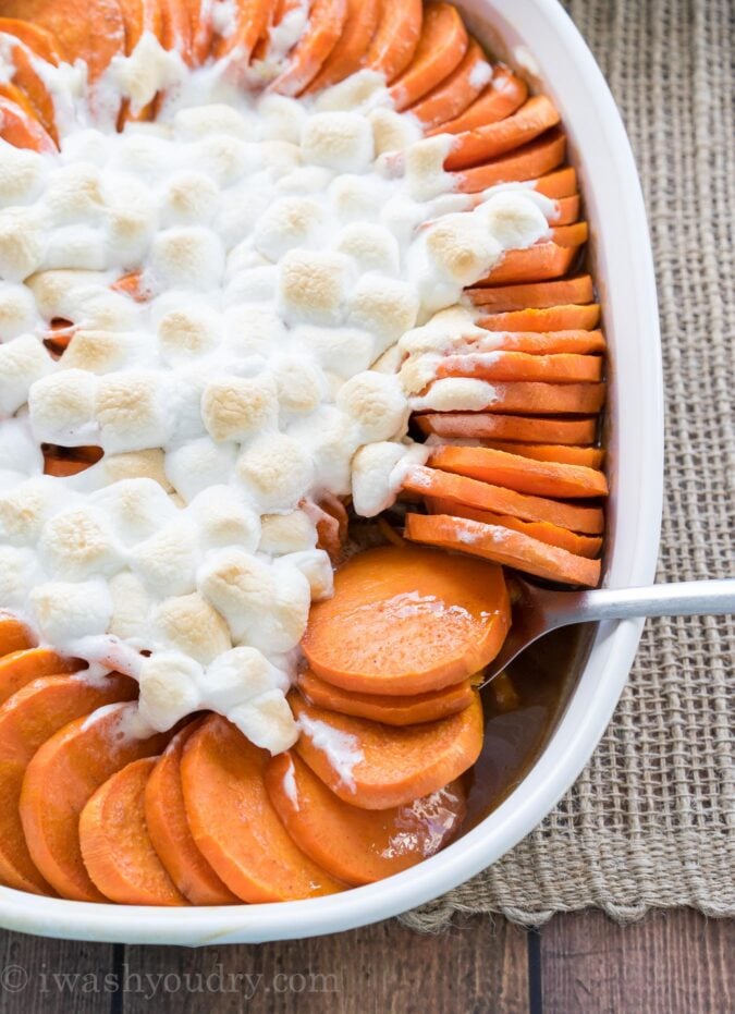 This No Boil Candied Sweet Potato Casserole is a crazy simple side dish recipe that's perfect for Thanksgiving or Christmas! I love this easy method of cooking the sweet potatoes! 