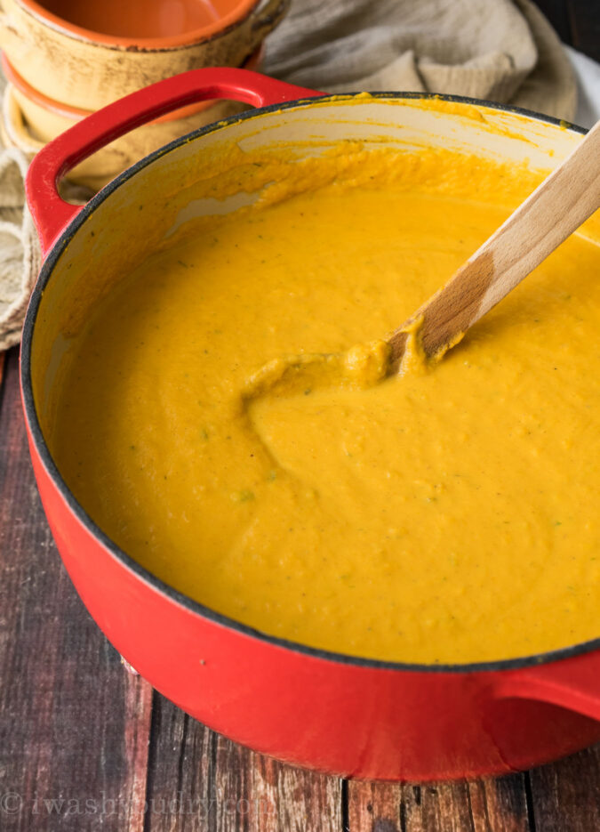 This Creamy Pumpkin and Acorn Squash Soup is the perfect recipe to warm up on a cold winter's night! I love the roasted pepitas on top!