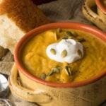 This Creamy Pumpkin and Acorn Squash Soup is the perfect recipe to warm up on a cold winter's night! I love the roasted pepitas on top!