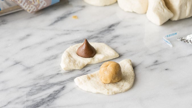 All the goodness of the classic peanut butter blossom, wrapped up in a warm and delicious monkey bread! My family loves this fun dessert recipe, but sometimes we even eat this for breakfast! 