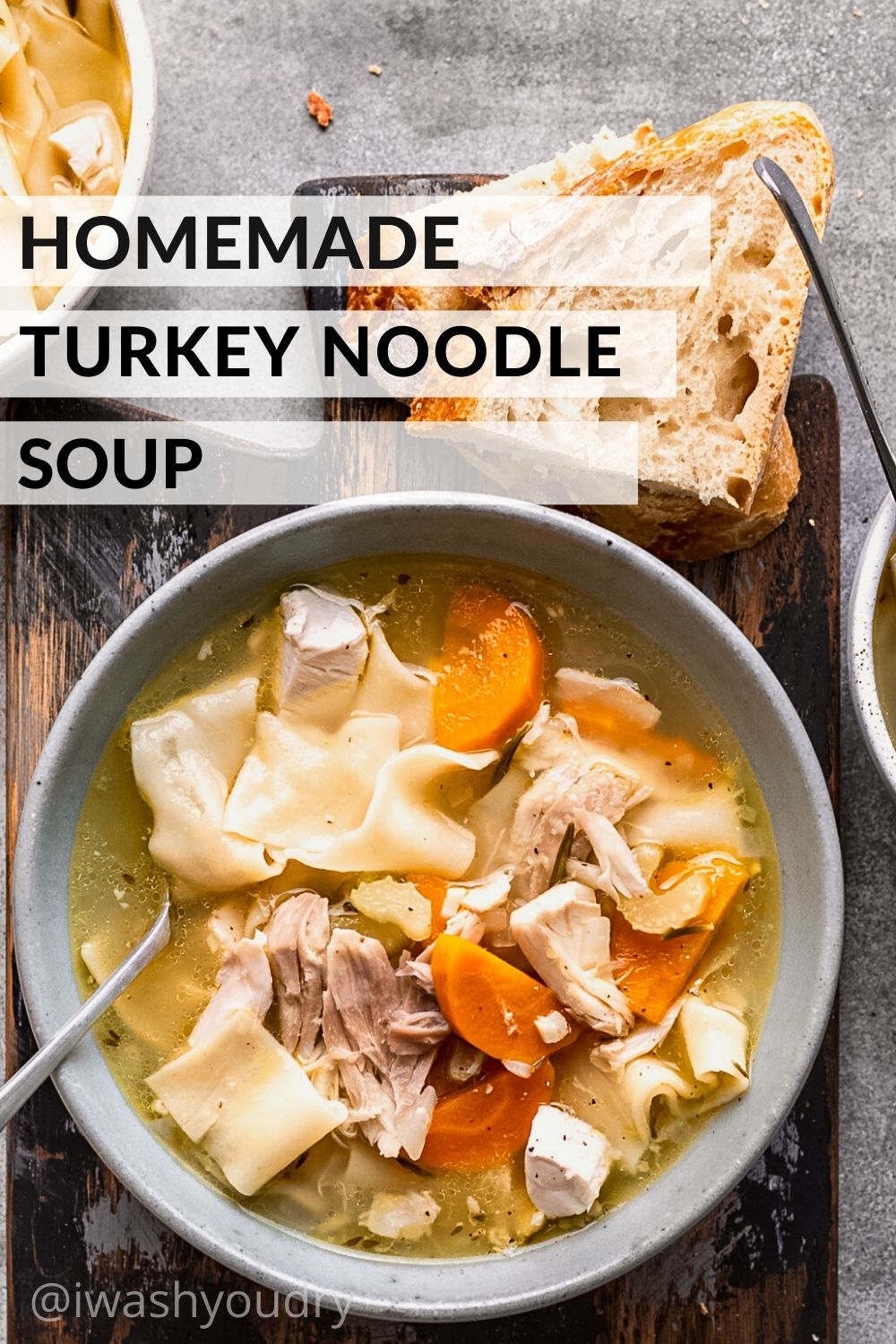Cooked Turkey noodle soup in white bowl.