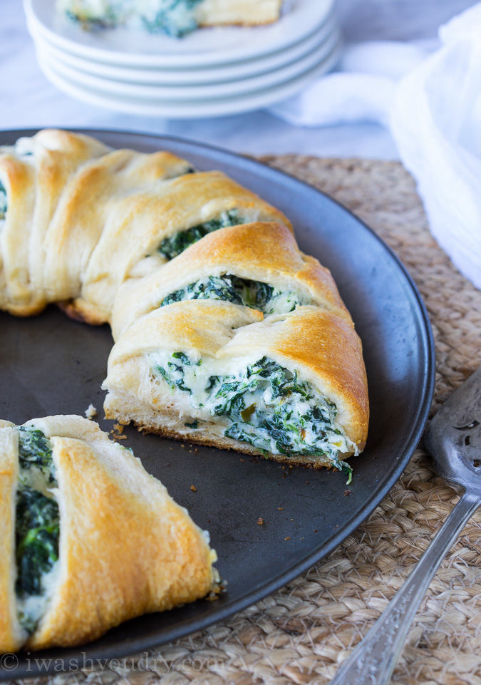 This Cheesy Spinach Jalapeño Crescent Ring is loaded with cream cheese, monterey jack cheese, spinach and diced pickled jalapeños. It's so easy to make and EVERYONE loves it! 