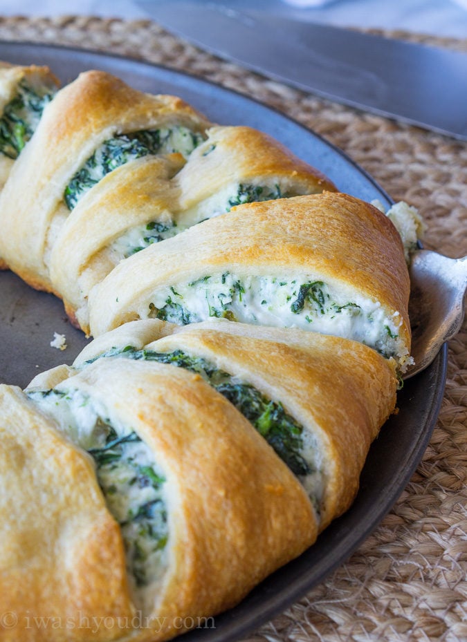 This Cheesy Spinach Jalapeño Crescent Ring is loaded with cream cheese, monterey jack cheese, spinach and diced pickled jalapeños. It's so easy to make and EVERYONE loves it! 