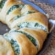 This Cheesy Spinach Jalapeño Crescent Ring is loaded with cream cheese, monterey jack cheese, spinach and diced pickled jalapeños. It's so easy to make and EVERYONE loves it!
