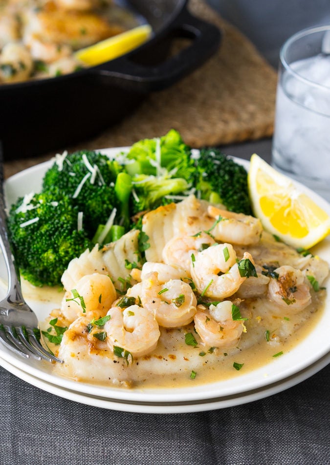 This quick and easy Skillet Tilapia with Shrimp is made in just one skillet and have an outrageously good white wine lemon pan sauce! My whole family loved this! 