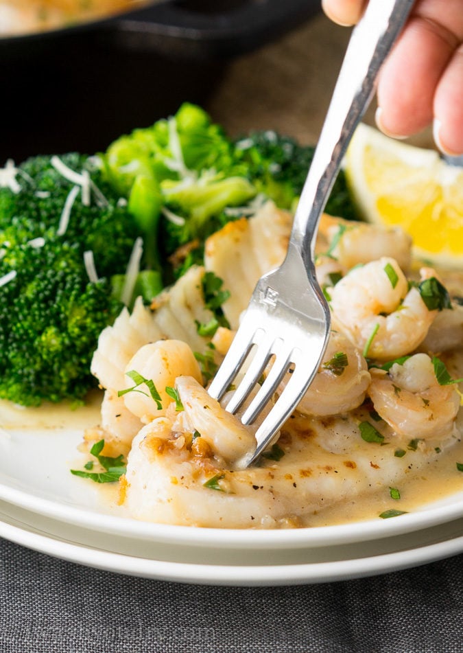 This quick and easy Skillet Tilapia with Shrimp is made in just one skillet and have an outrageously good white wine lemon pan sauce! My whole family loved this! 