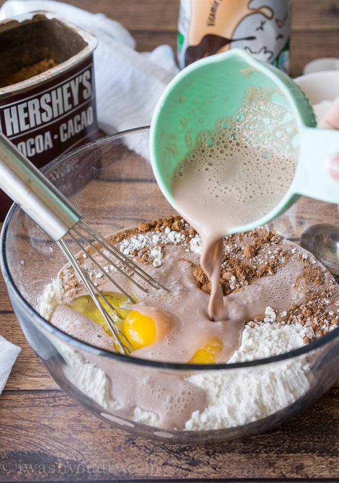 These Chocolate Pancakes are just a few simple ingredients and are made extra special with a scoop of vanilla ice cream and drizzle of chocolate syrup! 