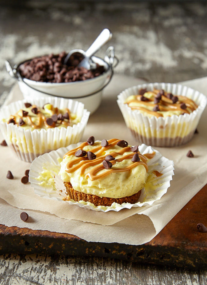 These Mini No Bake Chocolate Peanut Butter Cheesecakes have a Reese's Puffs cereal crust with a creamy vanilla bean cheesecake and a swirl of peanut butter on top. So easy and totally delicious!