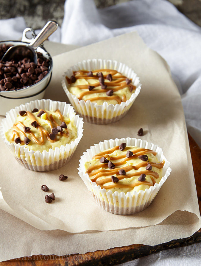 These Mini No Bake Chocolate Peanut Butter Cheesecakes have a Reese's Puffs cereal crust with a creamy vanilla bean cheesecake and a swirl of peanut butter on top. So easy and totally delicious!