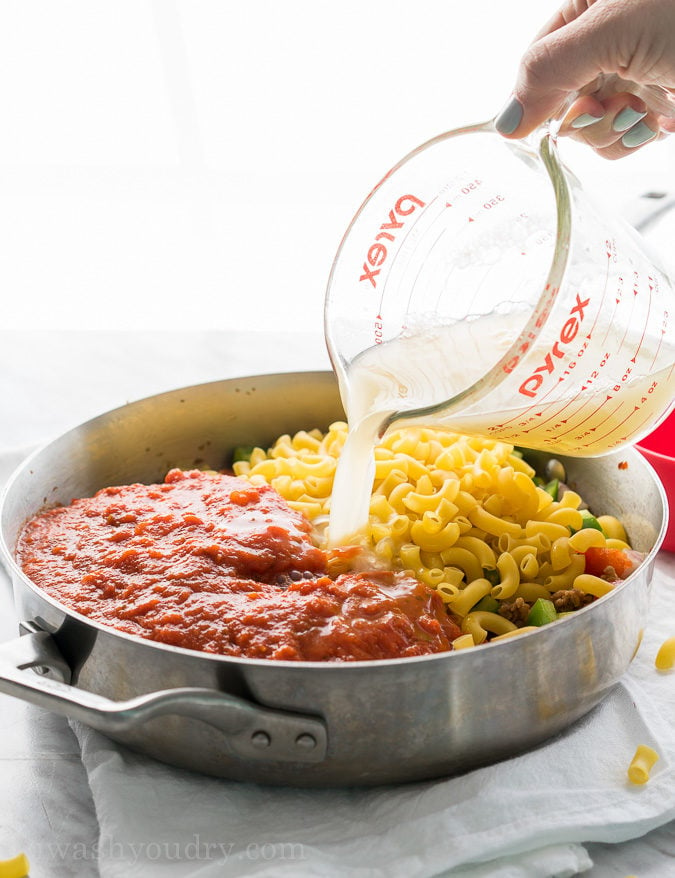 This Cheesy Sausage and Macaroni Skillet dinner recipe is super quick and easy, perfect for busy weeknights!