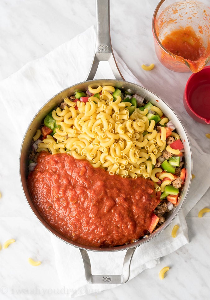 This Cheesy Sausage and Macaroni Skillet dinner recipe is super quick and easy, perfect for busy weeknights!