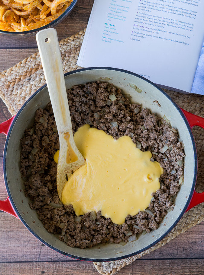 This Cheeseburger and French Fry Casserole is filled with all the hamburger favorites and even topped with crispy seasoned french fries and a creamy fry sauce!