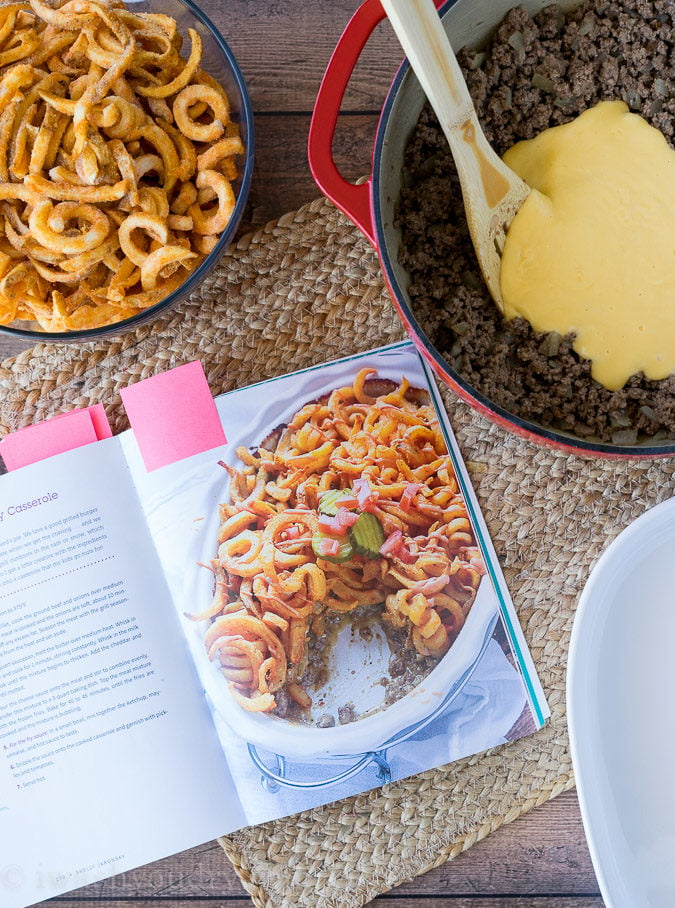 This Cheeseburger and French Fry Casserole is filled with all the hamburger favorites and even topped with crispy seasoned french fries and a creamy fry sauce!