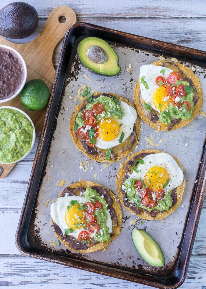 These Huevos Rancheros Tostadas with Avocado Salsa Verde are the ultimate breakfast, brunch or brinner recipe! Super quick and easy to make. My whole family loves these! 