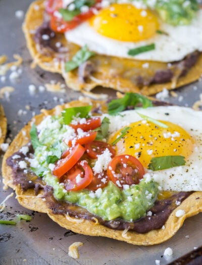 These Huevos Rancheros Tostadas with Avocado Salsa Verde are the ultimate breakfast, brunch or brinner recipe! Super quick and easy to make. My whole family loves these!
