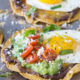 These Huevos Rancheros Tostadas with Avocado Salsa Verde are the ultimate breakfast, brunch or brinner recipe! Super quick and easy to make. My whole family loves these!