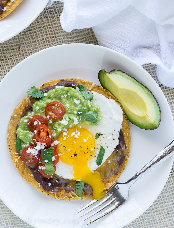 These Huevos Rancheros Tostadas with Avocado Salsa Verde are the ultimate breakfast, brunch or brinner recipe! Super quick and easy to make. My whole family loves these! 