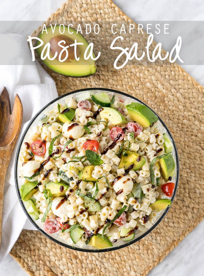 This Avocado Caprese Pasta Salad is a cold pasta salad that is perfect for parties and bbq's! Full of fresh veggies and creamy pasta! 