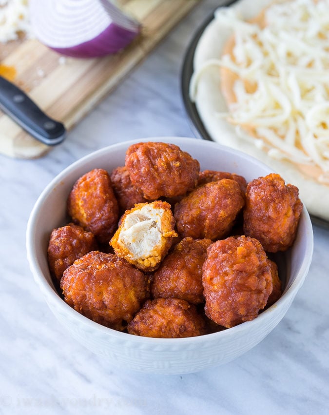 The combination of Buffalo Wings and Pizza in a creamy and cheesy Buffalo Ranch Chicken Pizza! So good with Hidden Valley's new Buffalo Ranch dressing! 