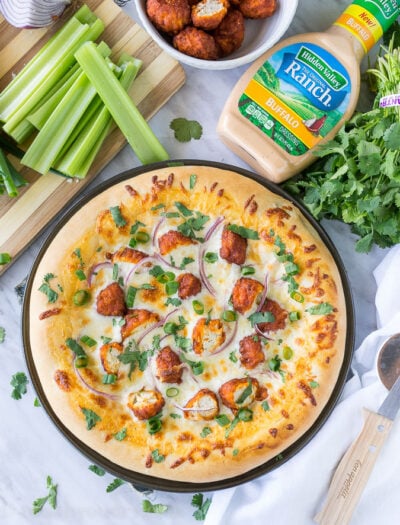 The combination of Buffalo Wings and Pizza in a creamy and cheesy Buffalo Ranch Chicken Pizza! So good with Hidden Valley's new Buffalo Ranch dressing!