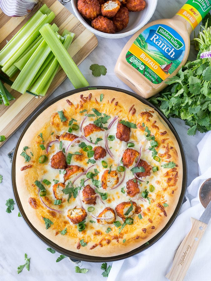 The combination of Buffalo Wings and Pizza in a creamy and cheesy Buffalo Ranch Chicken Pizza! So good with Hidden Valley's new Buffalo Ranch dressing! 