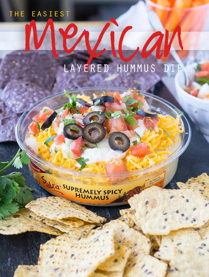 This is by far the easiest way to have your #unofficialmeal. This easy Mexican Layered Hummus Dip starts with a tub of Sabra hummus and is piled high with all the classic taco fillings! So good!