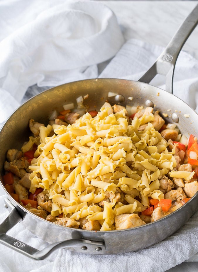 This Cajun Chicken Pasta Skillet is creamy, cheesy and slightly spicy ! This easy dinner recipe is made in just one skillet too!