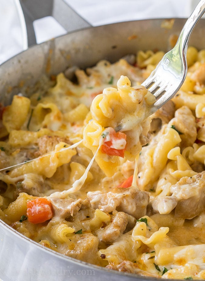 This Cajun Chicken Pasta Skillet is creamy, cheesy and slightly spicy ! This easy dinner recipe is made in just one skillet too!