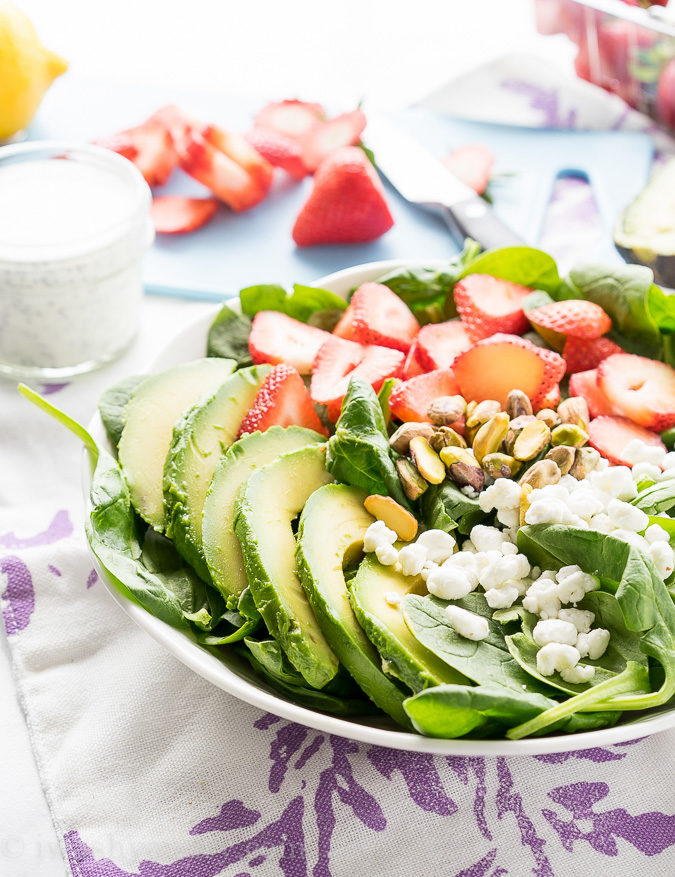 This Avocado Strawberry Spinach Salad is a quick and easy lunch recipe that's perfect for hot summer days!