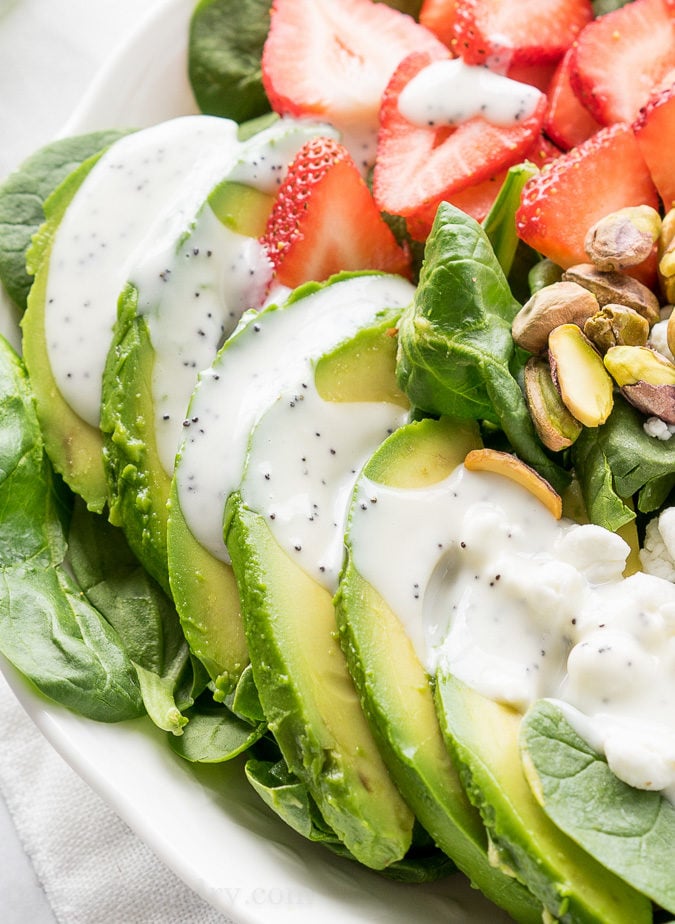 This Avocado Strawberry Spinach Salad is a quick and easy lunch recipe that's perfect for hot summer days!