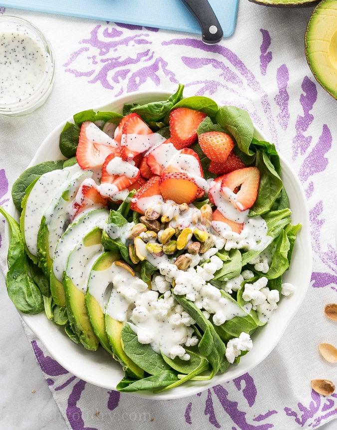 This Avocado Strawberry Spinach Salad is a quick and easy lunch recipe that's perfect for hot summer days!