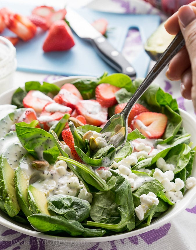 This Avocado Strawberry Spinach Salad is a quick and easy lunch recipe that's perfect for hot summer days!