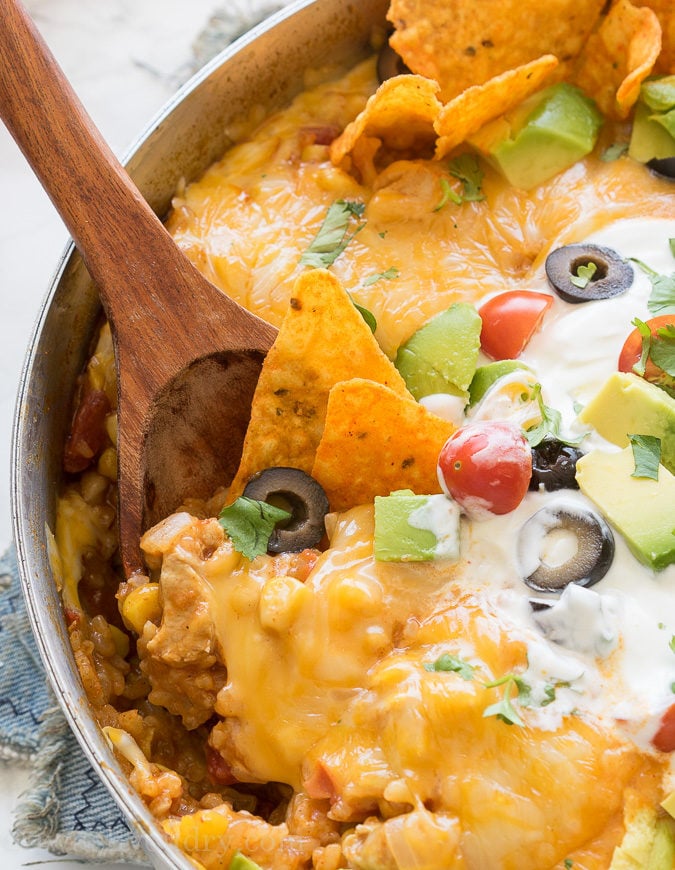This pan, the Mexican Chicken Taco Skillet, is filled with chicken, rice, and corn, then topped with all the delicious tacos for a delicious dinner recipe that my family asks for over and over again!