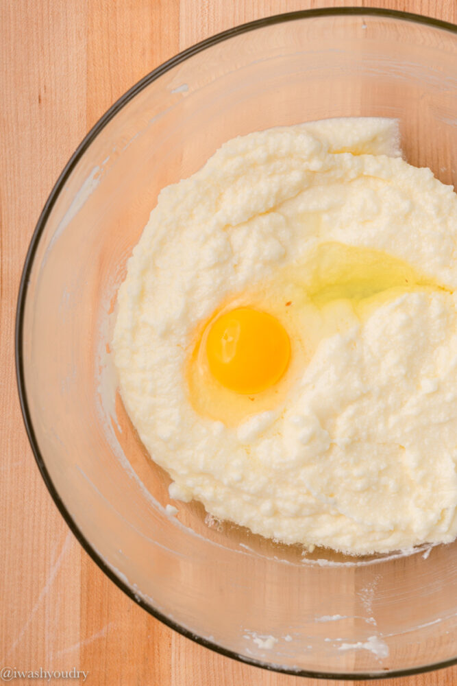 Egg in bread batter in bowl