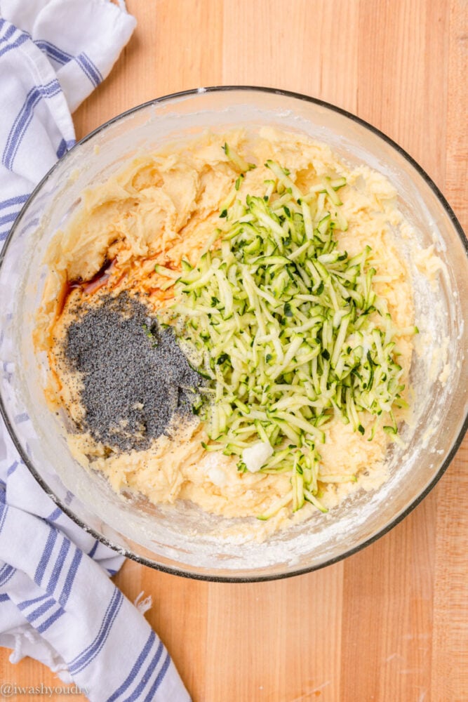 zucchini and poppy seeds in bowl with batter