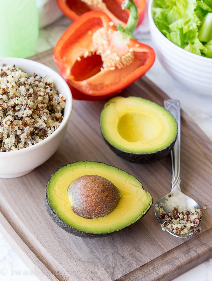 These Quinoa Stuffed Avocados are a super quick and delicious appetizer or meatless lunch/dinner recipe! I can't get enough of these!