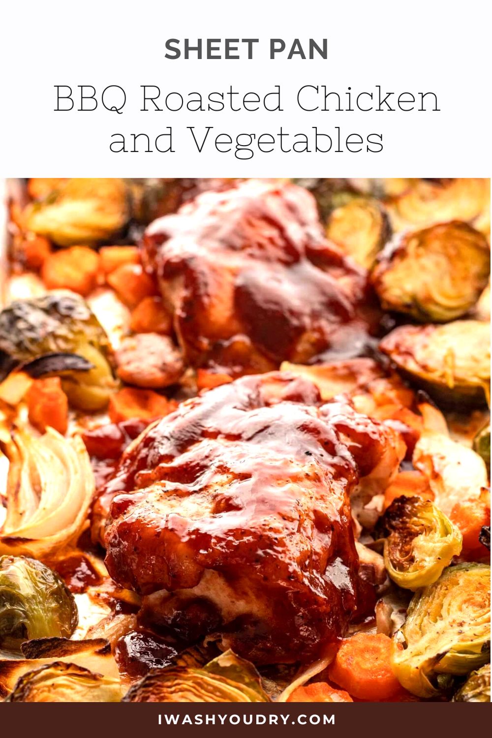 bbq roasted chicken thighs with vegetables on metal baking pan.