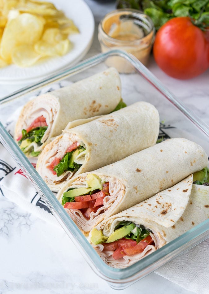 These Cajun Turkey Avocado Wraps are the perfect way to spruce up your lunch box! Filled with thinly sliced deli turkey, plump tomatoes, creamy avocado and a zippy cajun mayo, these wraps are bursting with flavor!