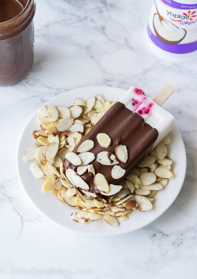 These Raspberry Coconut Fro-Yo Popsicles are just 4 ingredients (including the chocolate!). So fresh and creamy!