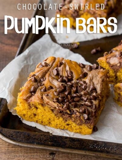 These Chocolate Swirled Pumpkin Bars are made on a large baking sheet, which make them perfect for taking to pot lucks and parties this Fall! I love that chocolate cheesecake swirled throughout too!