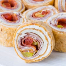 These super flavorful Italian Pinwheels are a fantastic appetizer or perfect for school lunches!