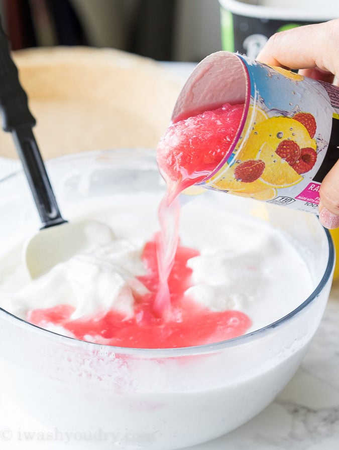 pour lemonade concentrate into ice cream and stir