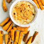 This Creamy Roasted Garlic Dip with sweet potato wedges is a tasty dip for your next football party!
