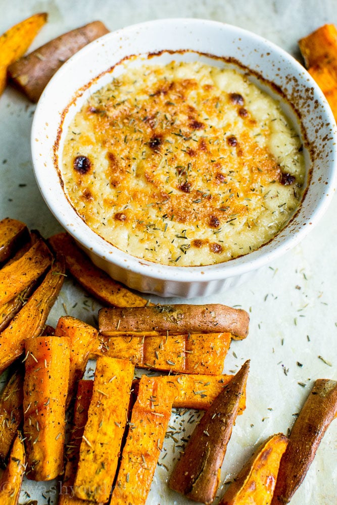 This Creamy Roasted Garlic Dip with sweet potato wedges is a tasty dip for your next football party!
