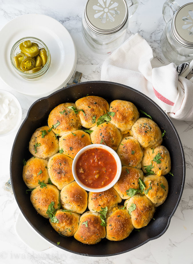 This Cheesy Taco Bombs Skillet is a quick and easy appetizer recipe that's filled with tender taco meat and gooey cheese!