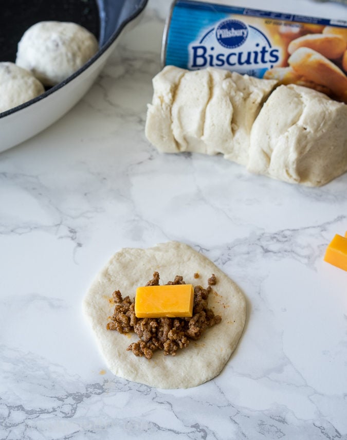 This Cheesy Taco Bombs Skillet is a quick and easy appetizer recipe that's filled with tender taco meat and gooey cheese!