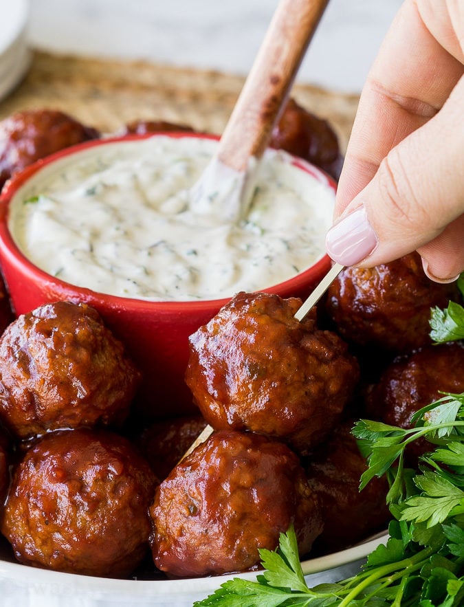 These Cranberry Meatballs with Sour Cream Herb Dip are super simple to make and are bursting with flavor! Perfect appetizer for this holiday season!