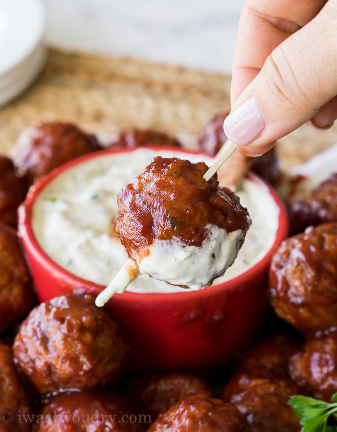 Saucy meatball with sour cream dip on a toothpick